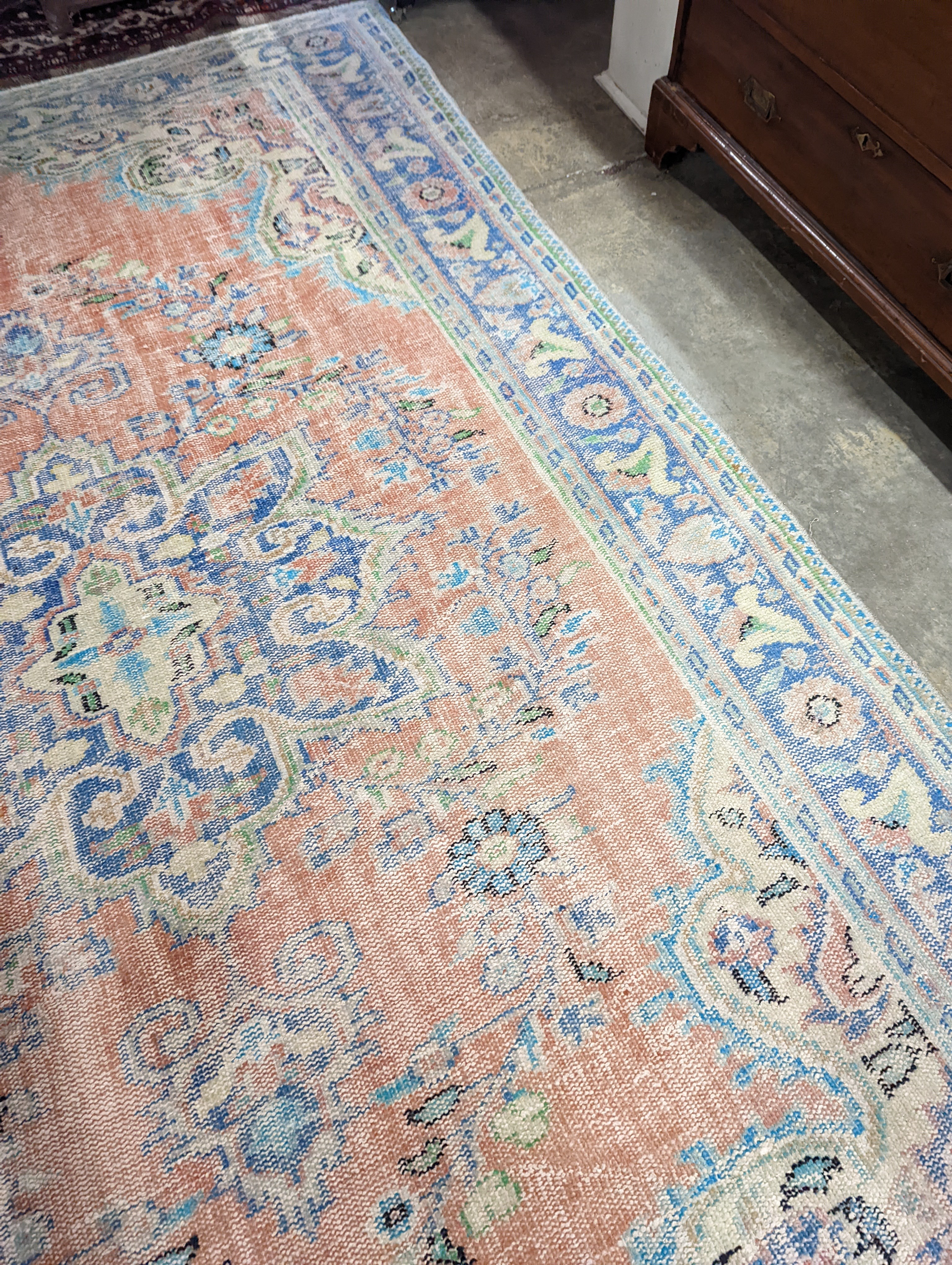 A North West Persian style faded wool carpet, 300 x 196cm